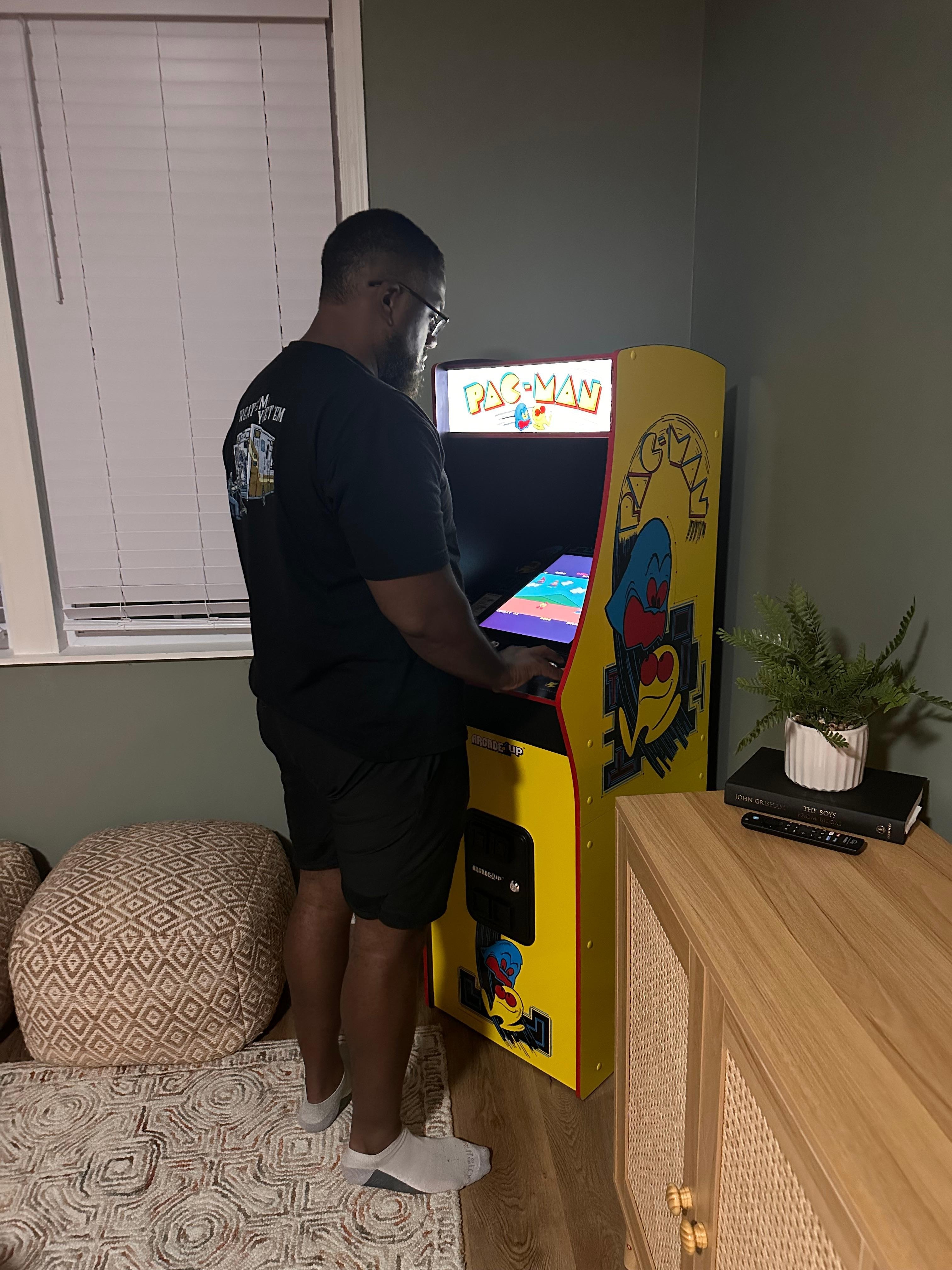 My husband playing PAC-Man