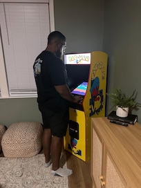 My husband playing PAC-Man