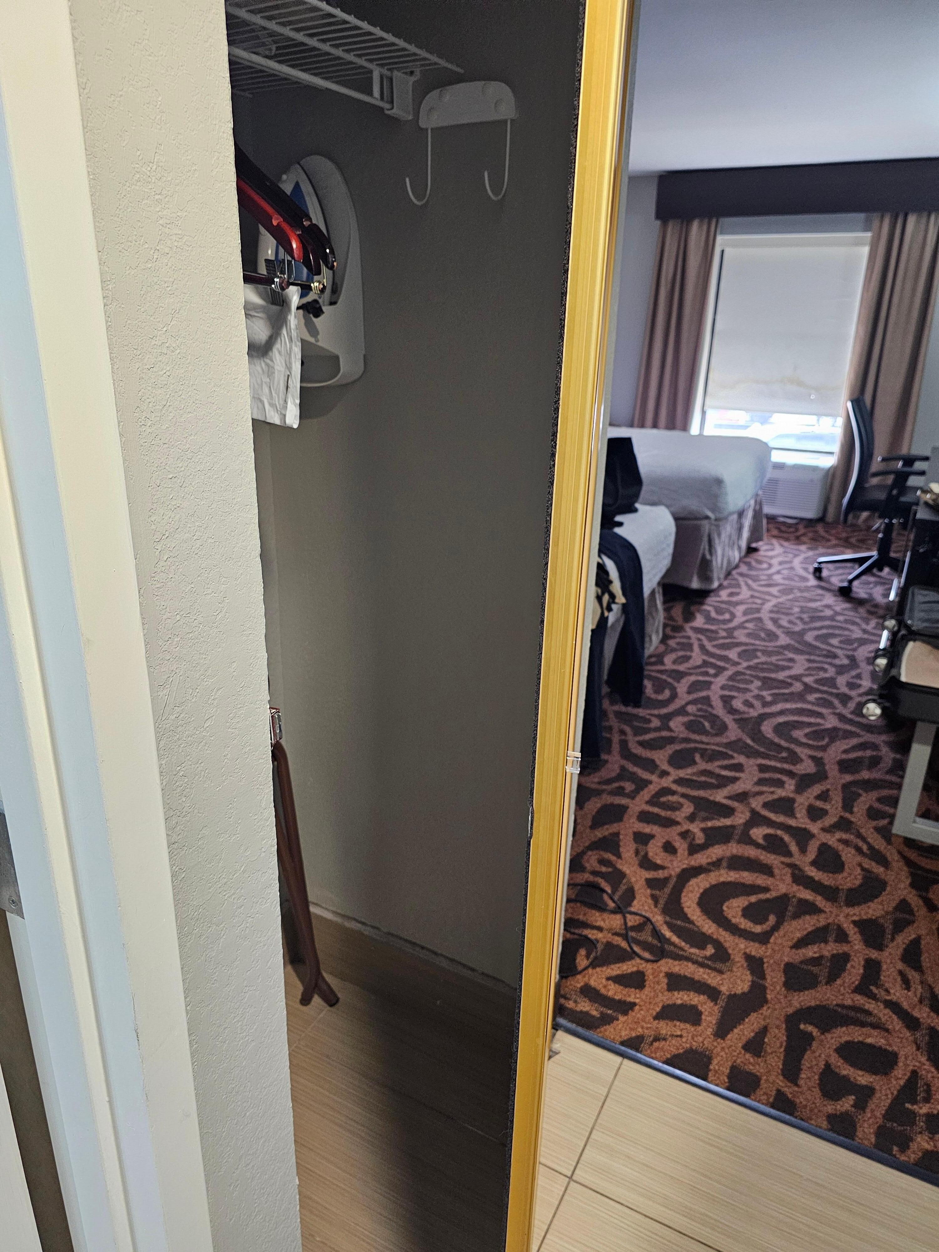 Closet door would not close and appeared to be about to come off hinges.