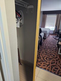 Closet door would not close and appeared to be about to come off hinges.