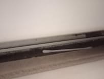 Garbage left under the heater.