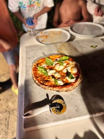 Finished pizza from oven