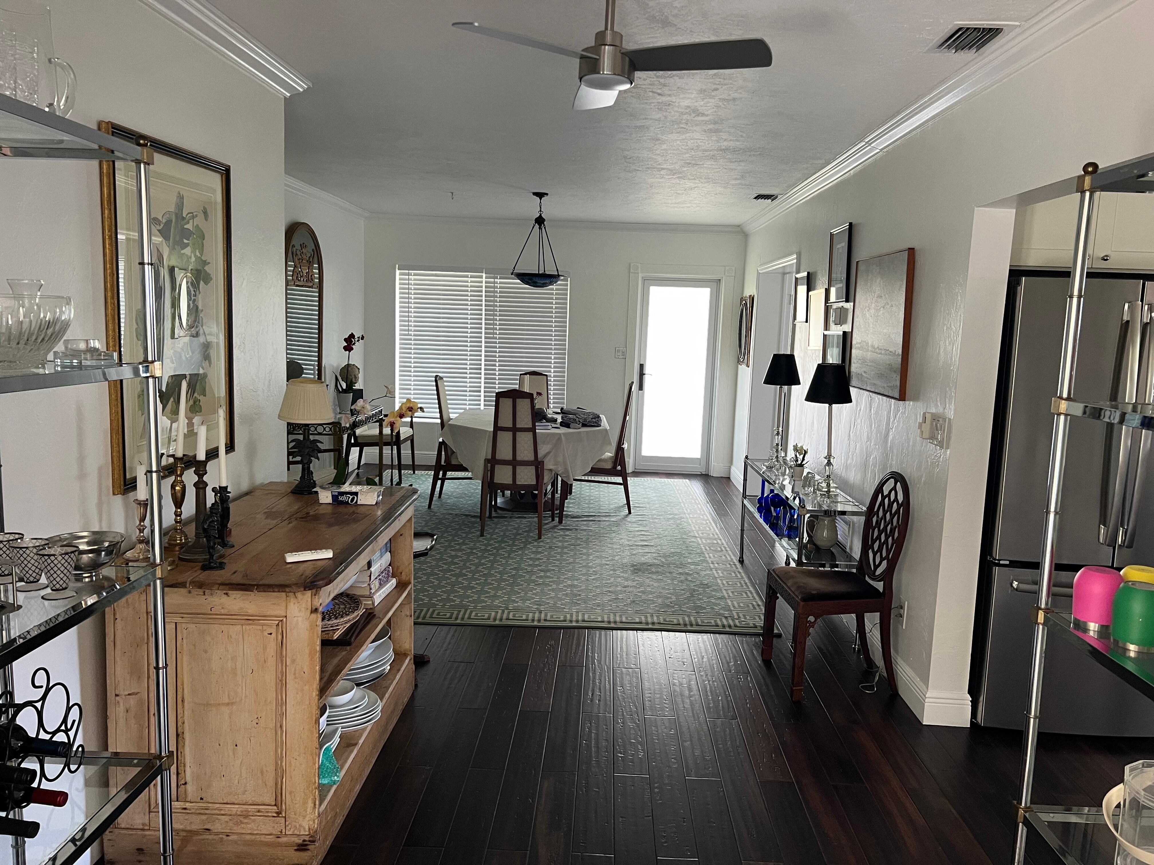 Standing in the sunroom looking towards the front door