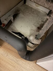 In the closet with the washer and dryer.