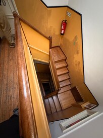 Looking down the stairwell from the top floor. (No elevator)