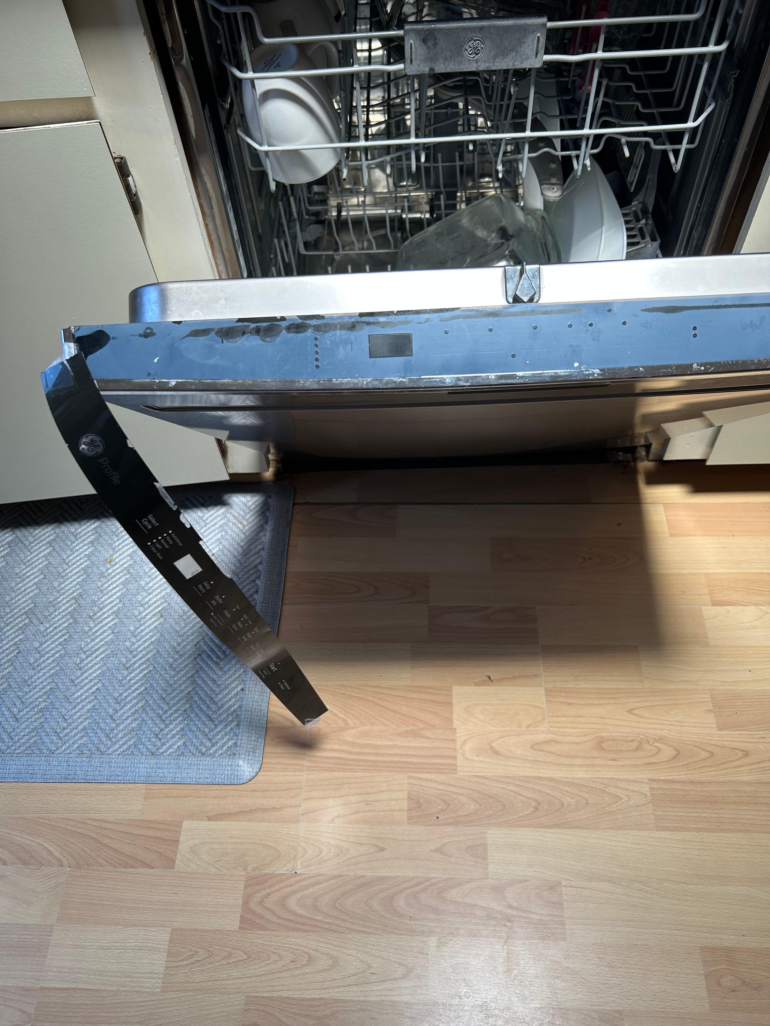 The part of the dishwasher that was held by scotch tape