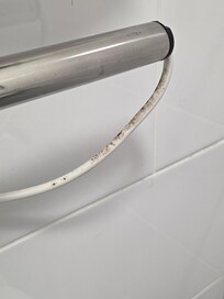 Thick dirt on towel rail that didn't heat up