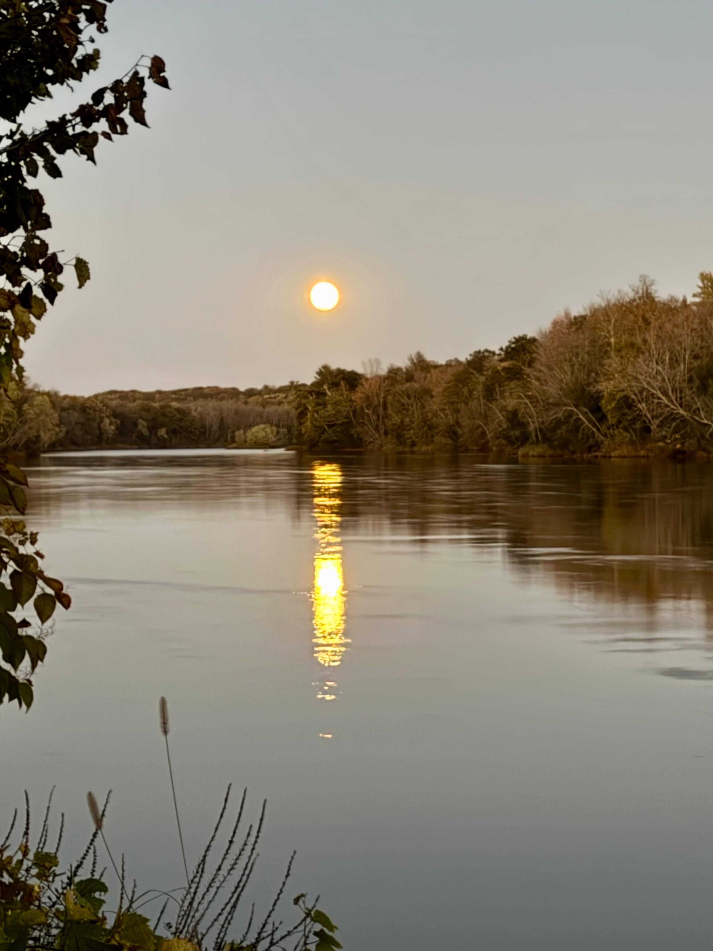 Almost a full moon rising over the river.