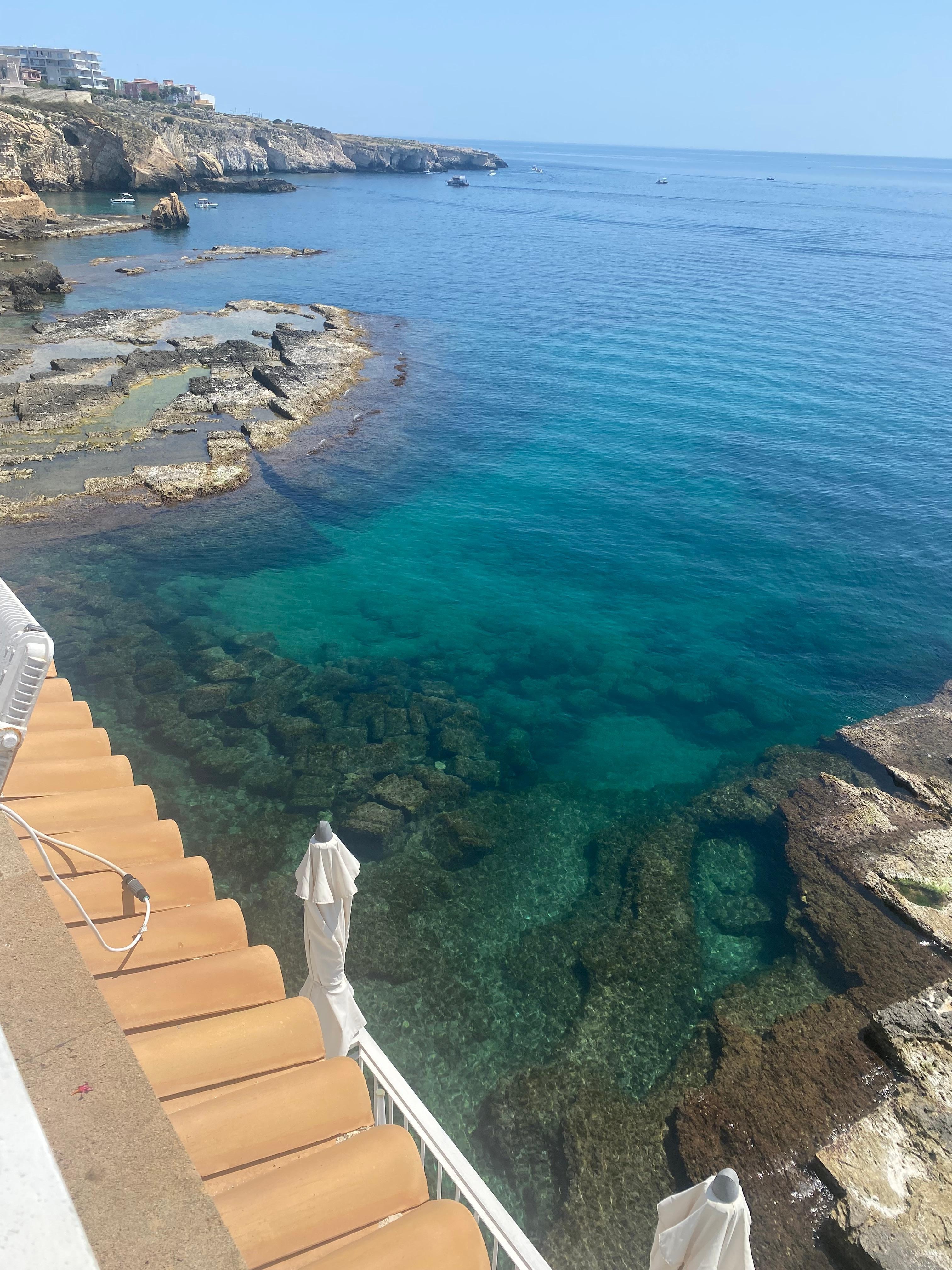 Clear blue sea below the hotel
