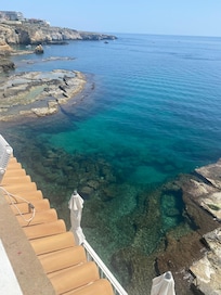 Clear blue sea below the hotel
