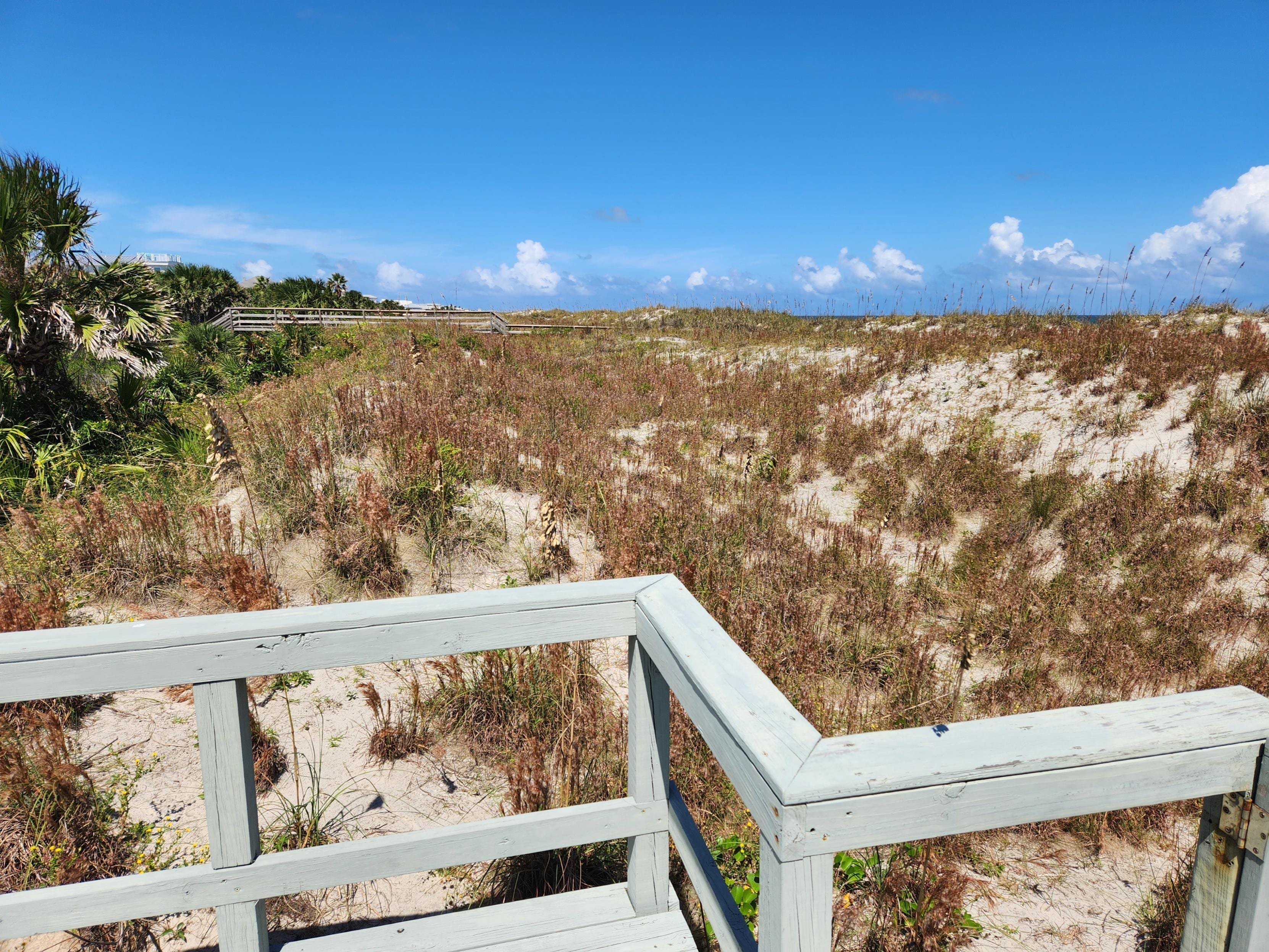 View from end of walkway toward beach.  Does not connect to beach.