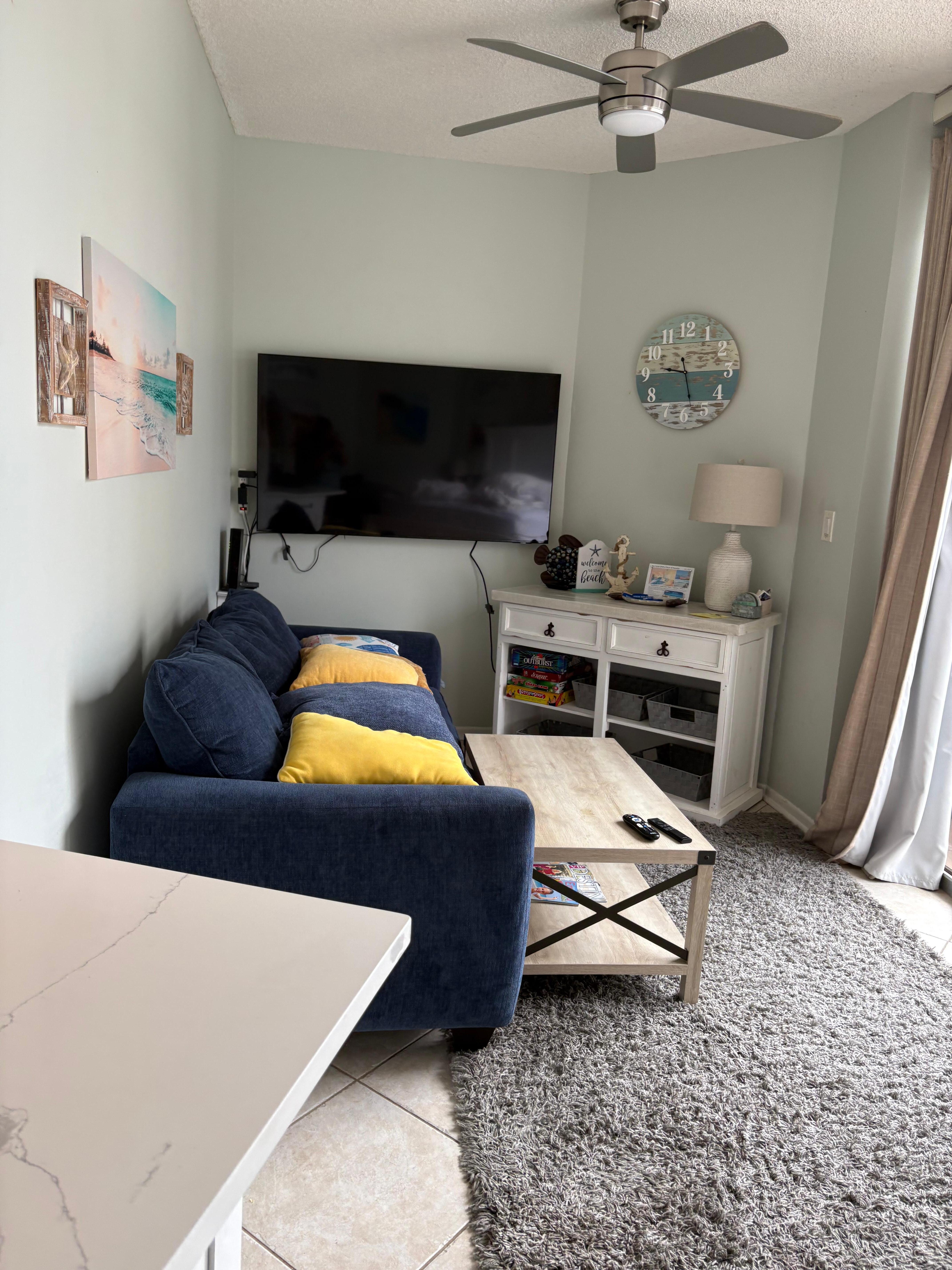 Tv is at a right angle to couch.