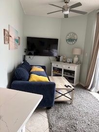 Tv is at a right angle to couch.