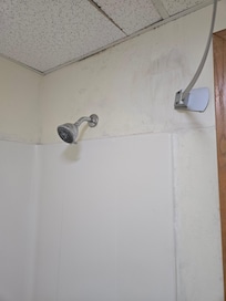 Walls patched and not painted. Ceiling tile broken in bathroom.