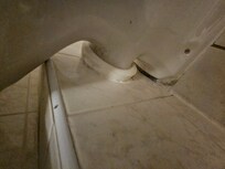 Behind toilet