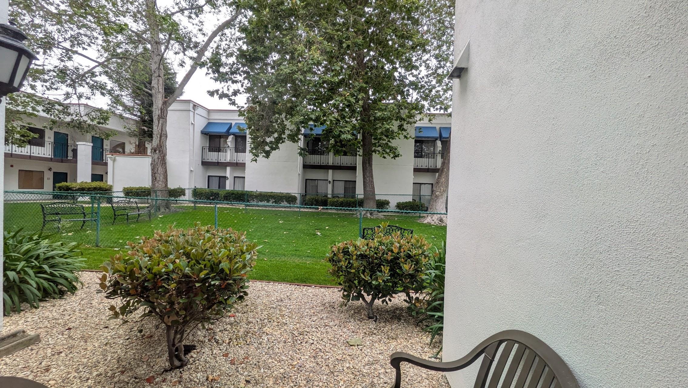 Dog run, behind our room. Chairs available on the small patio.