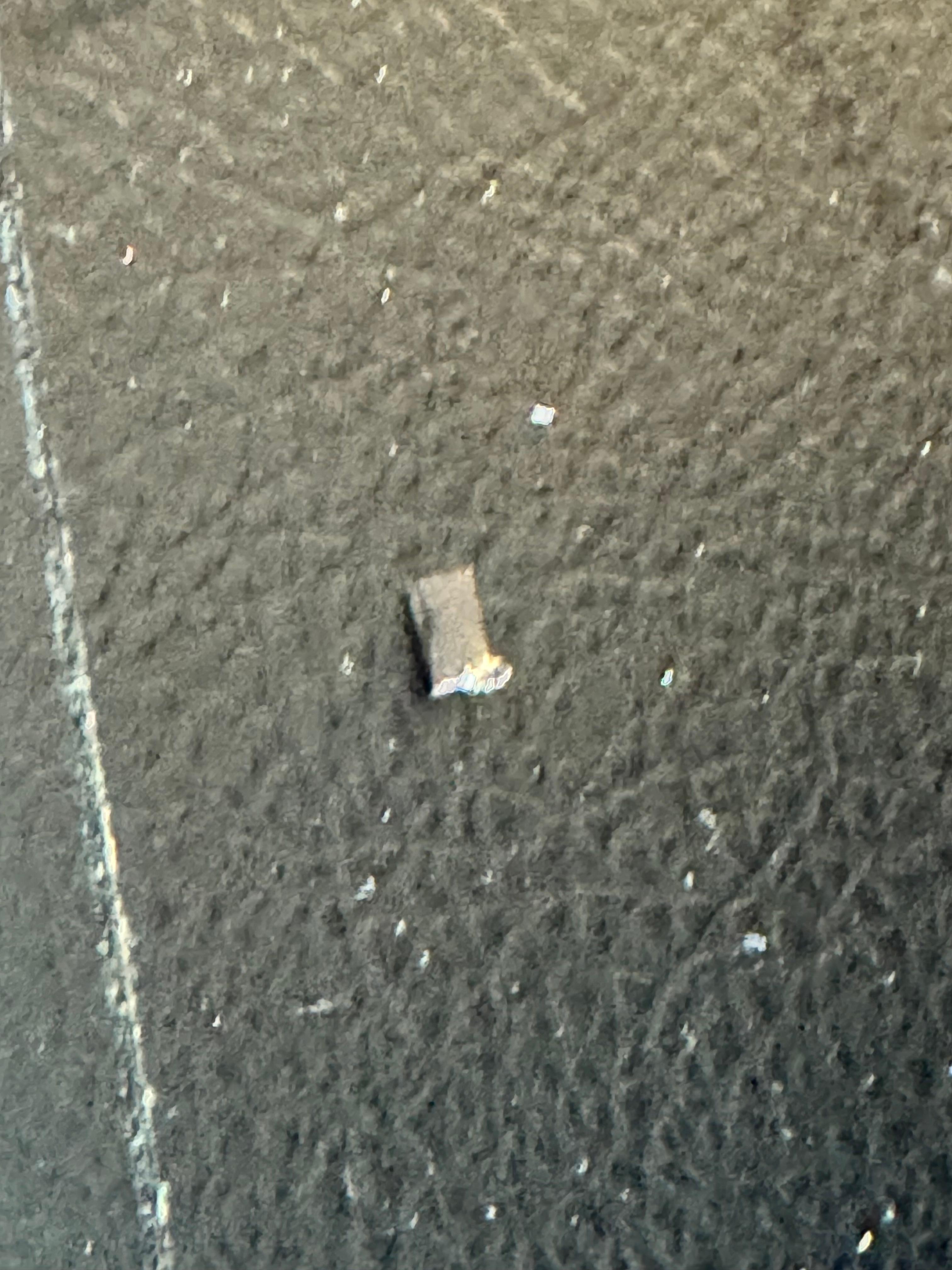 Broken pieces of something on the floor. 