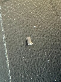 Broken pieces of something on the floor.