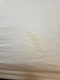 Yellow stain on sheet