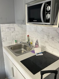 Microwave, stove top, fridge