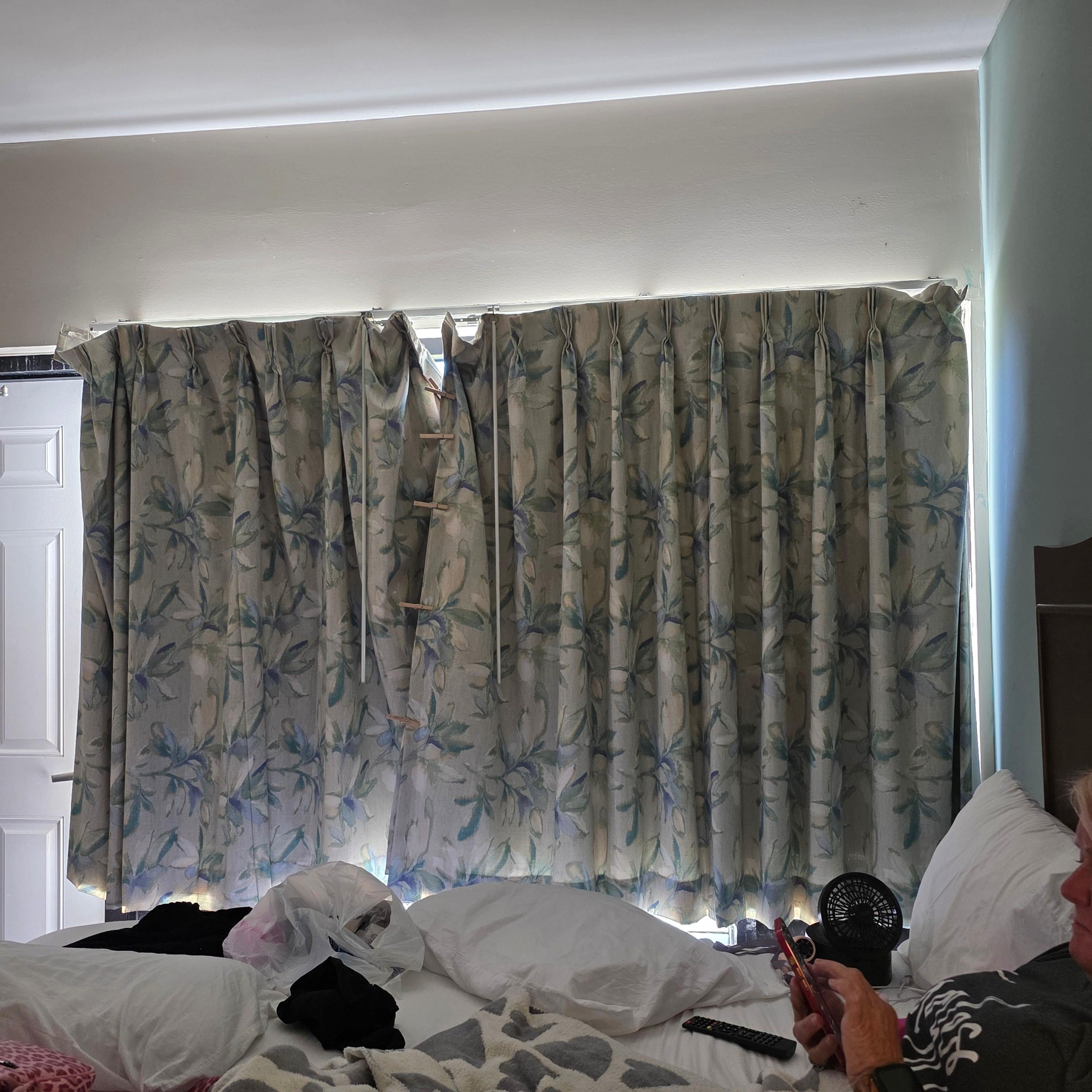 Curtains falling off the rod. This was after we managed to fix part of it.