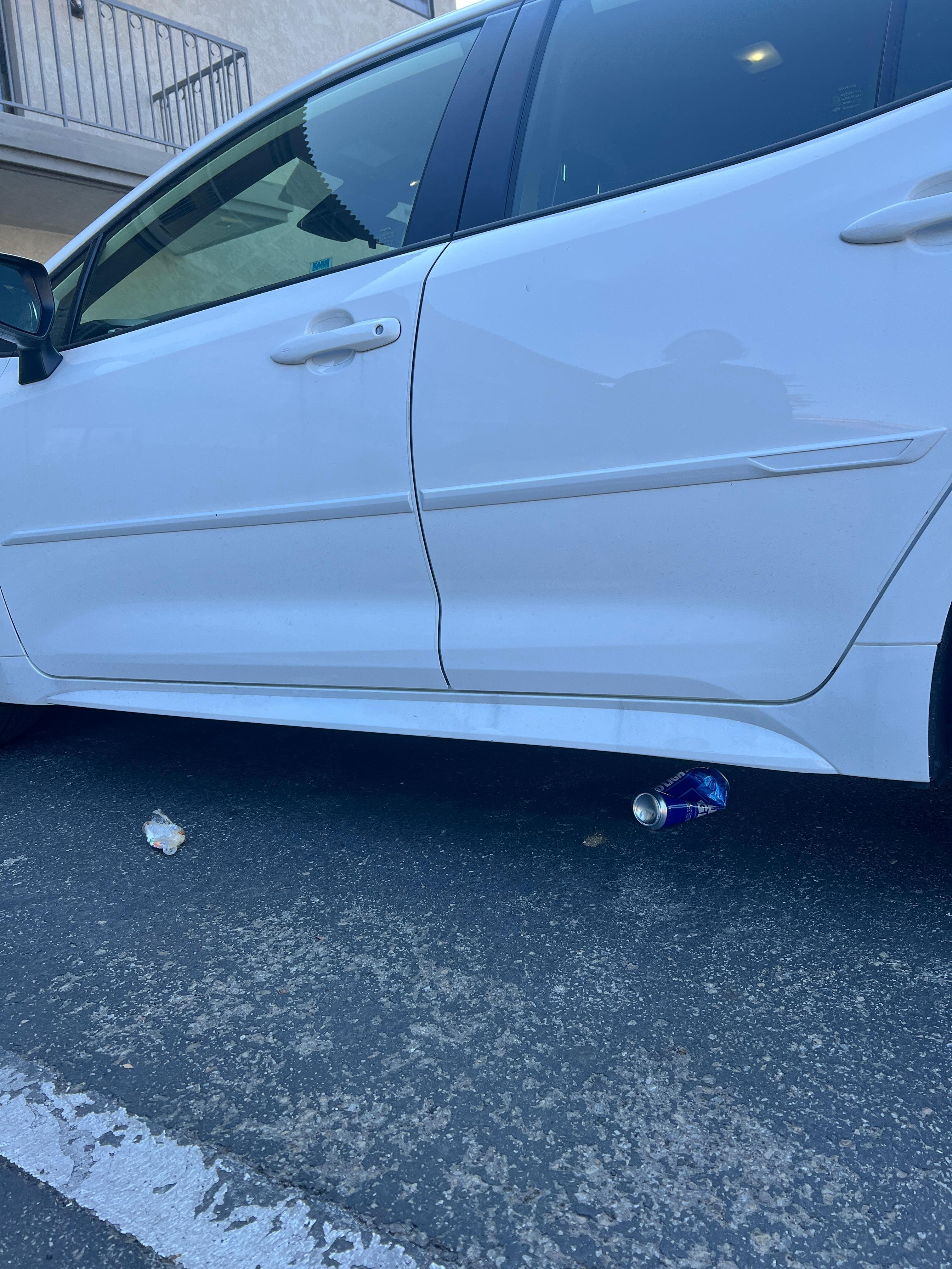 A beer can and wrapper were left around my car.