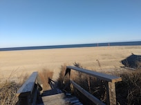 Two houses are between this house and the beach.