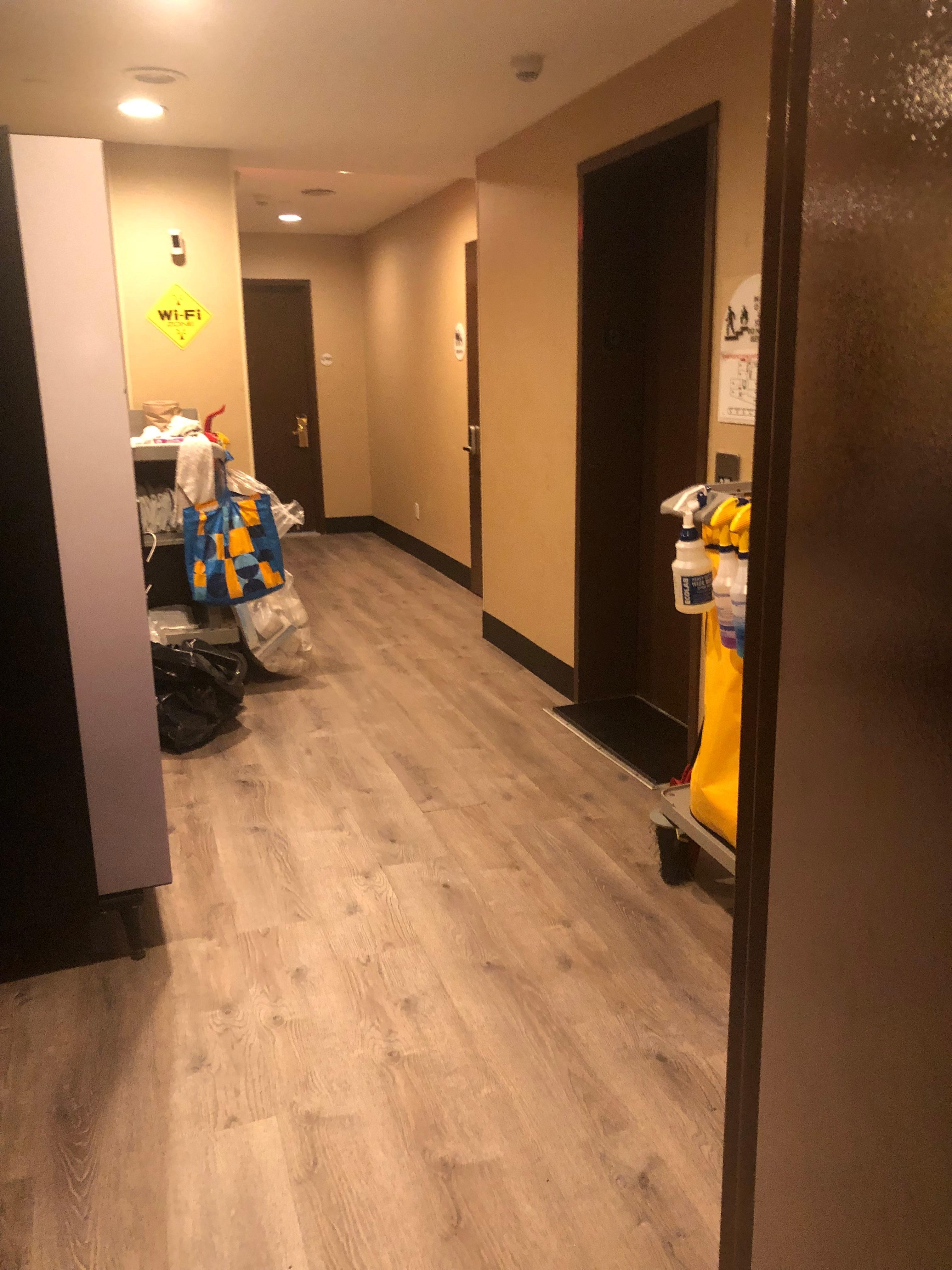 Basement area with cleaning trollies and ice machine