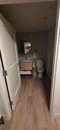 Bathroom with walk in shower, hair dryer, plenty of fresh towels