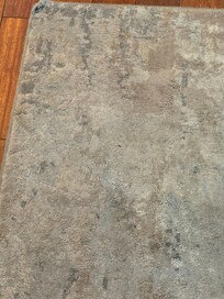 Dirt in indoor rug. Host claimed it is muted and brand new even though you can see the same rug in listings from 5 years ago