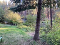 Sunrise view of the Metolius River from wrap- around porch