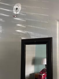 No smoke detector and wires dangling from the wall