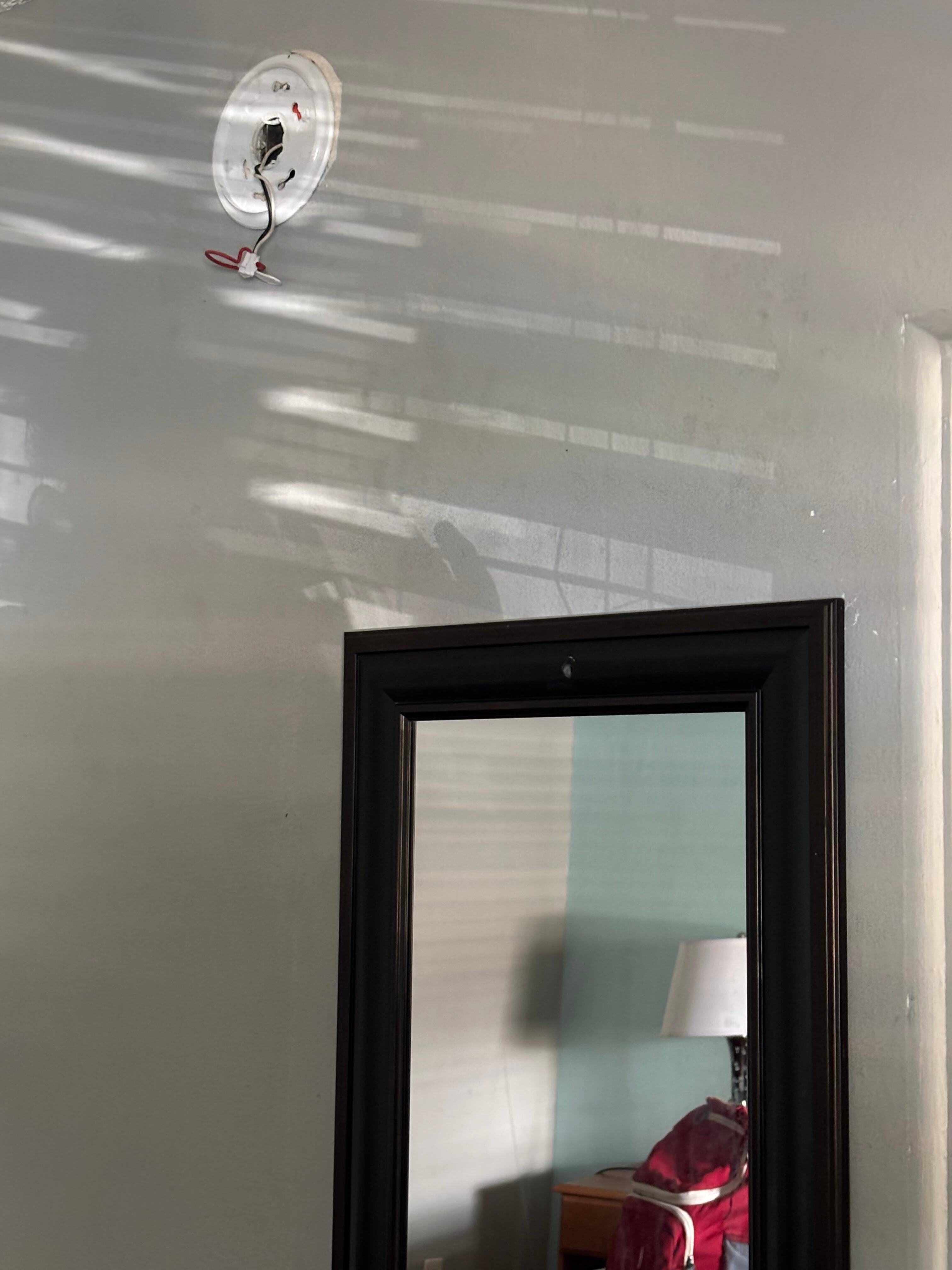 No smoke detector and wires dangling from the wall