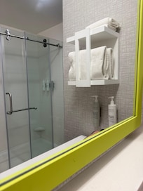 Toothpaste dots on the mirror, definitely not clean.