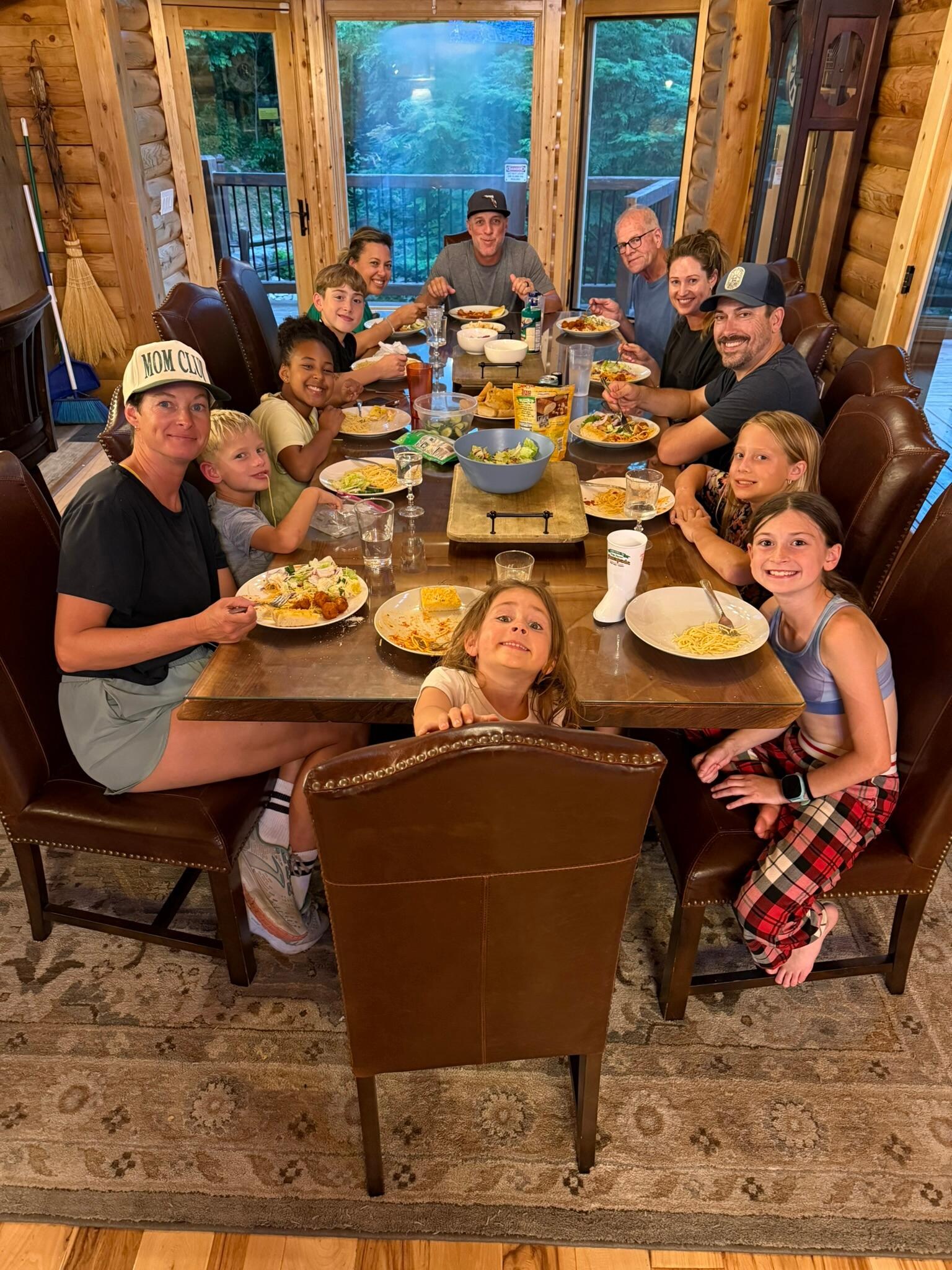 Our family enjoying a meal in Roaring Fork Lodge around the huge dining room table.