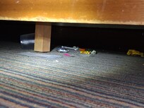 Under the TV in bedroom