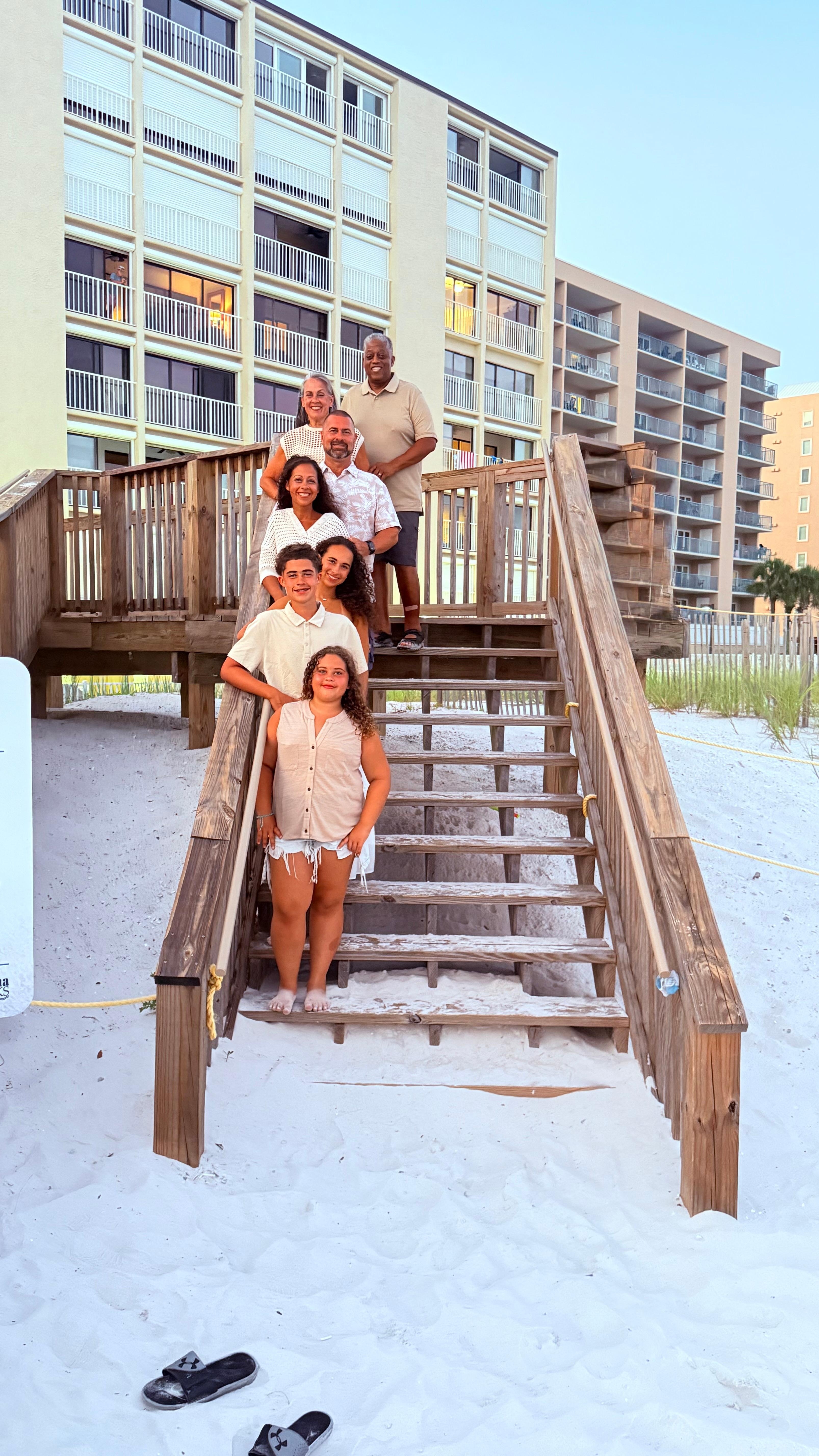 Family pic on stairs  up to the condo.
They’re is also a ramp for wagons. 
