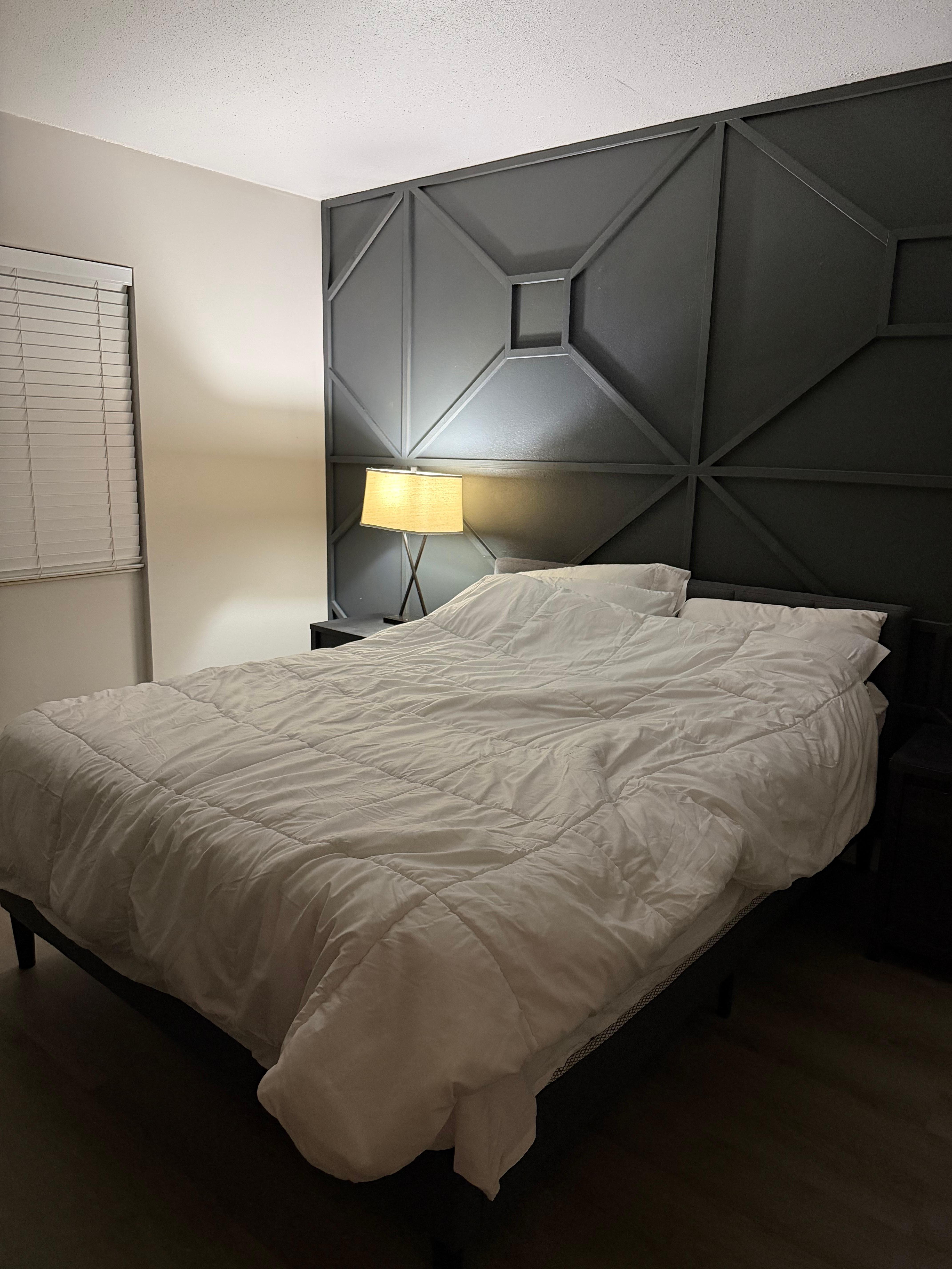 The light on the opposite side of the bed 