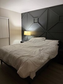 The light on the opposite side of the bed