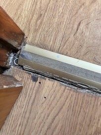 The loose threshold between the bathroom and bedroom
