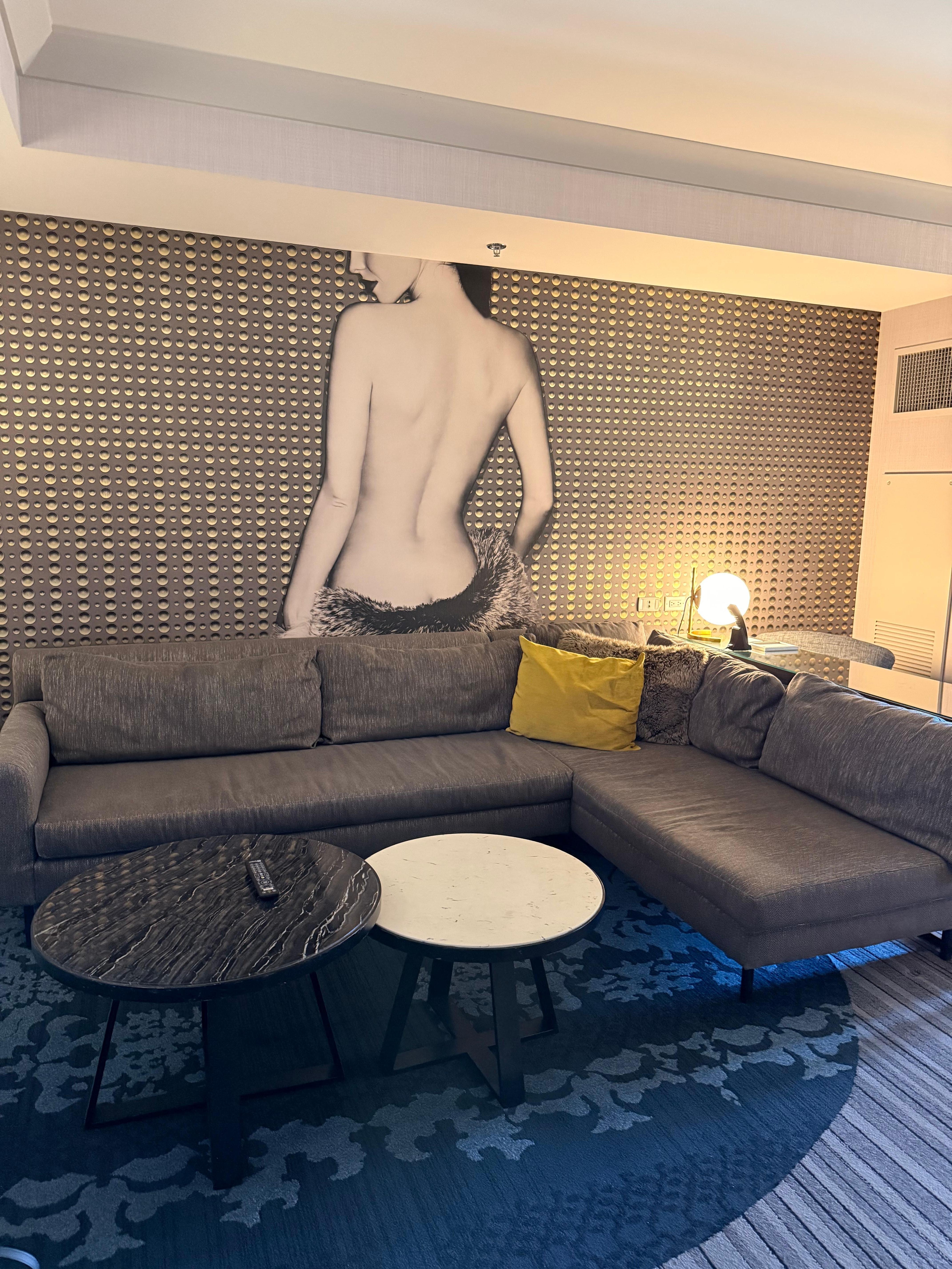 Sectional with work area desk and lamp behind it. 