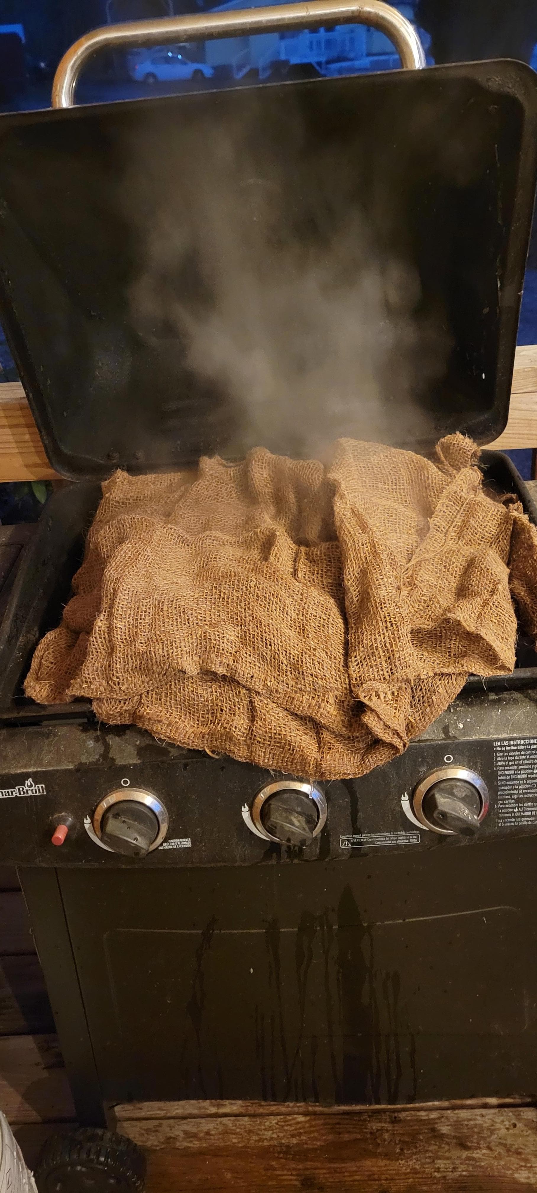 Oysters steaming/roasting on the gas grill. 