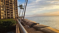 The sandbags / breakwater is right in front of the pool deck. There is no beach access from the property