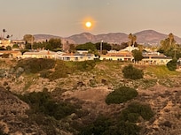 Backyard view of rising super moon