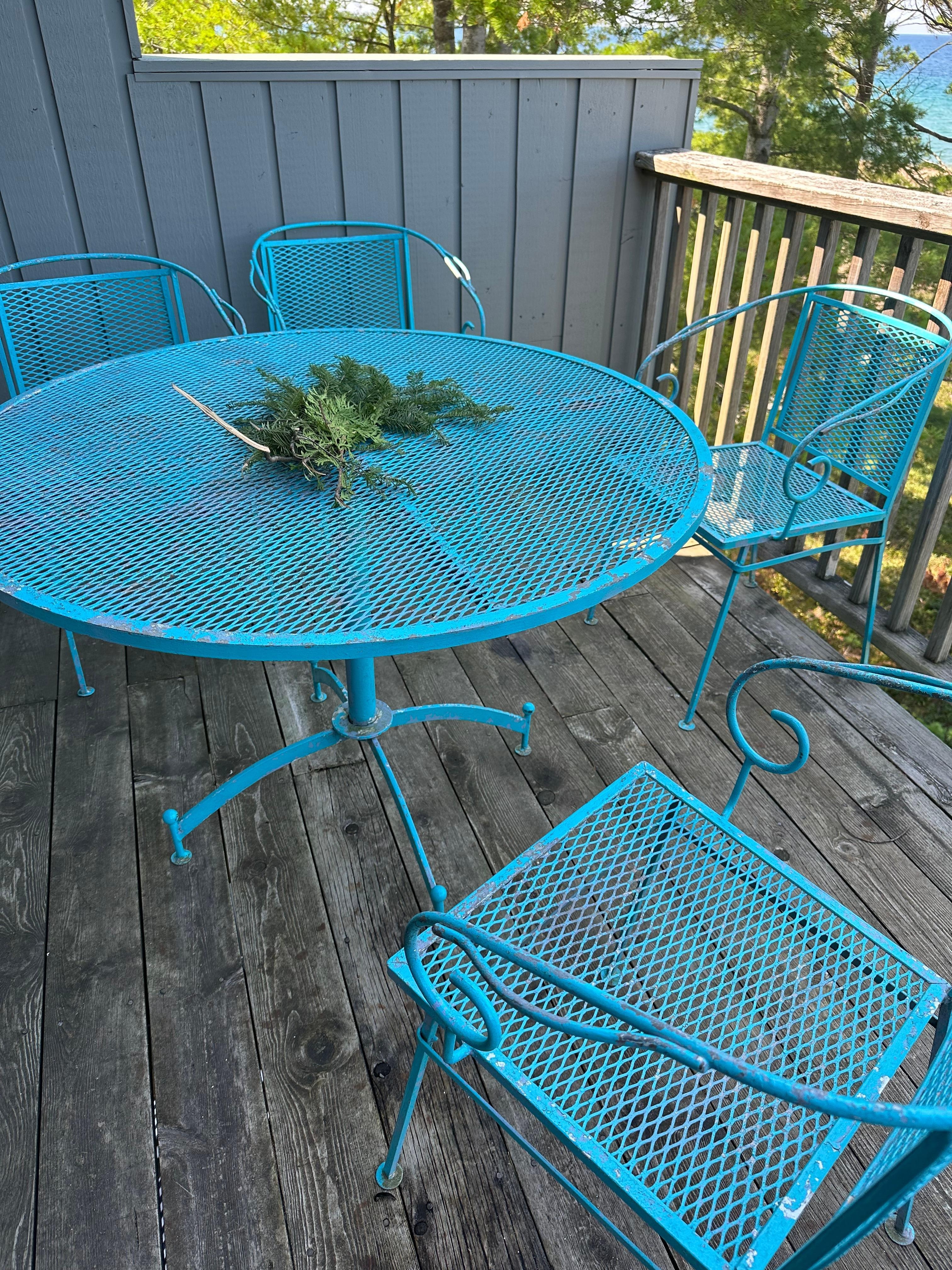 rusting deck furniture w paint flakes on floor