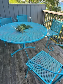 rusting deck furniture w paint flakes on floor