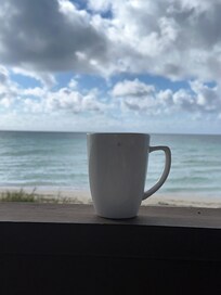 Morning coffee by the beach