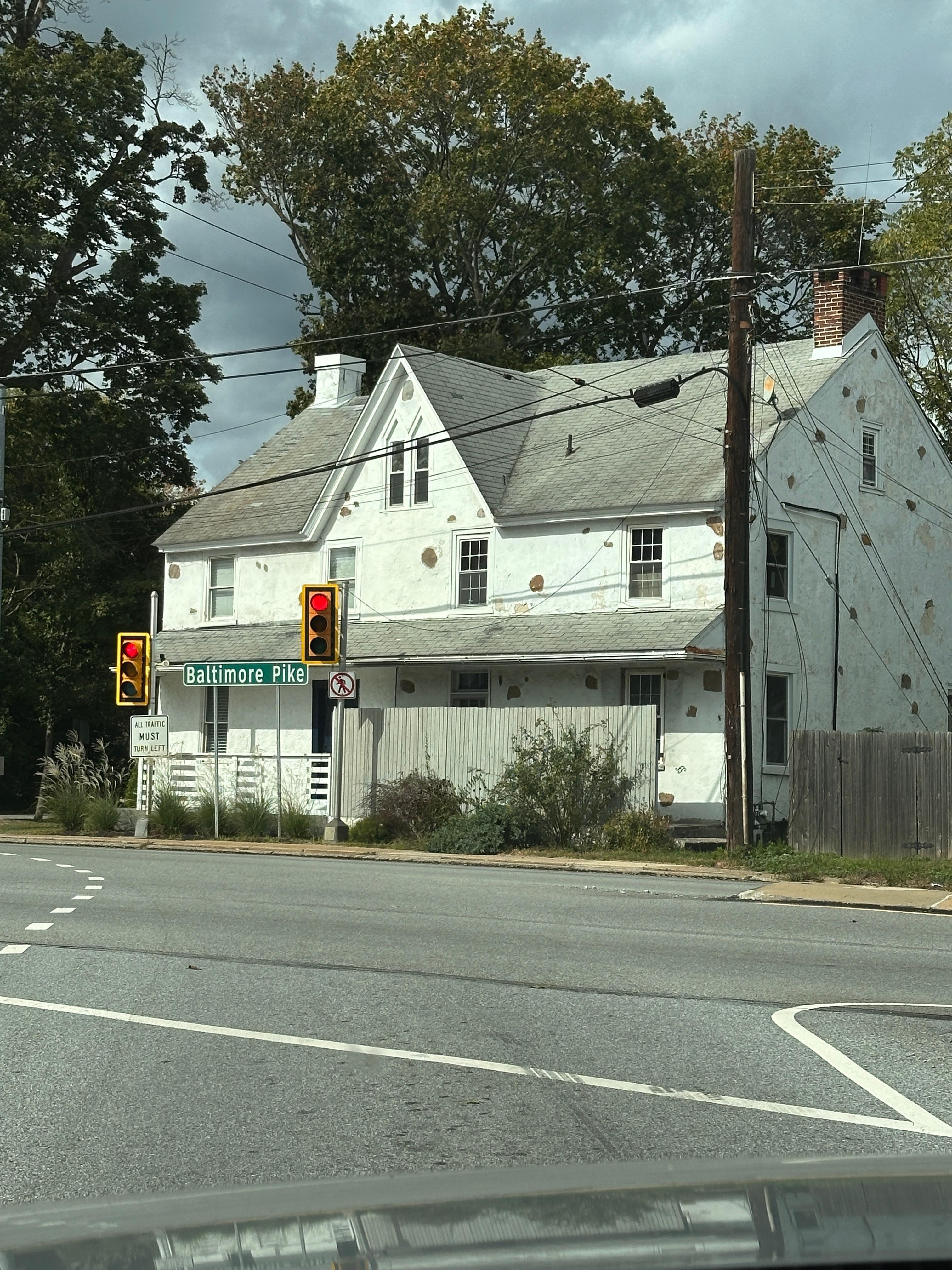 This is a side photo of the house. I hope it is in the process of being painted and not in just disrepair. Only the side of the house we came in was painted fully. 