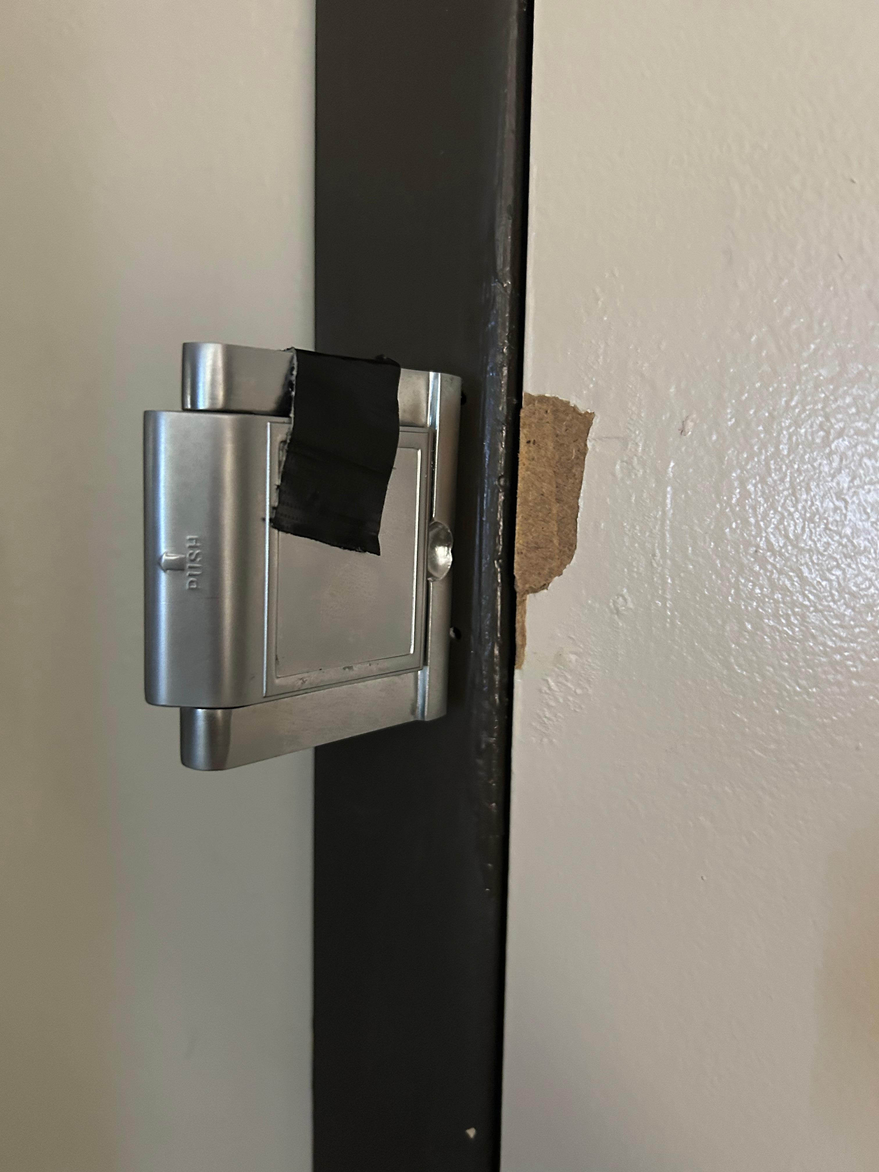 Wth is this broken ducktaped door lock in the room