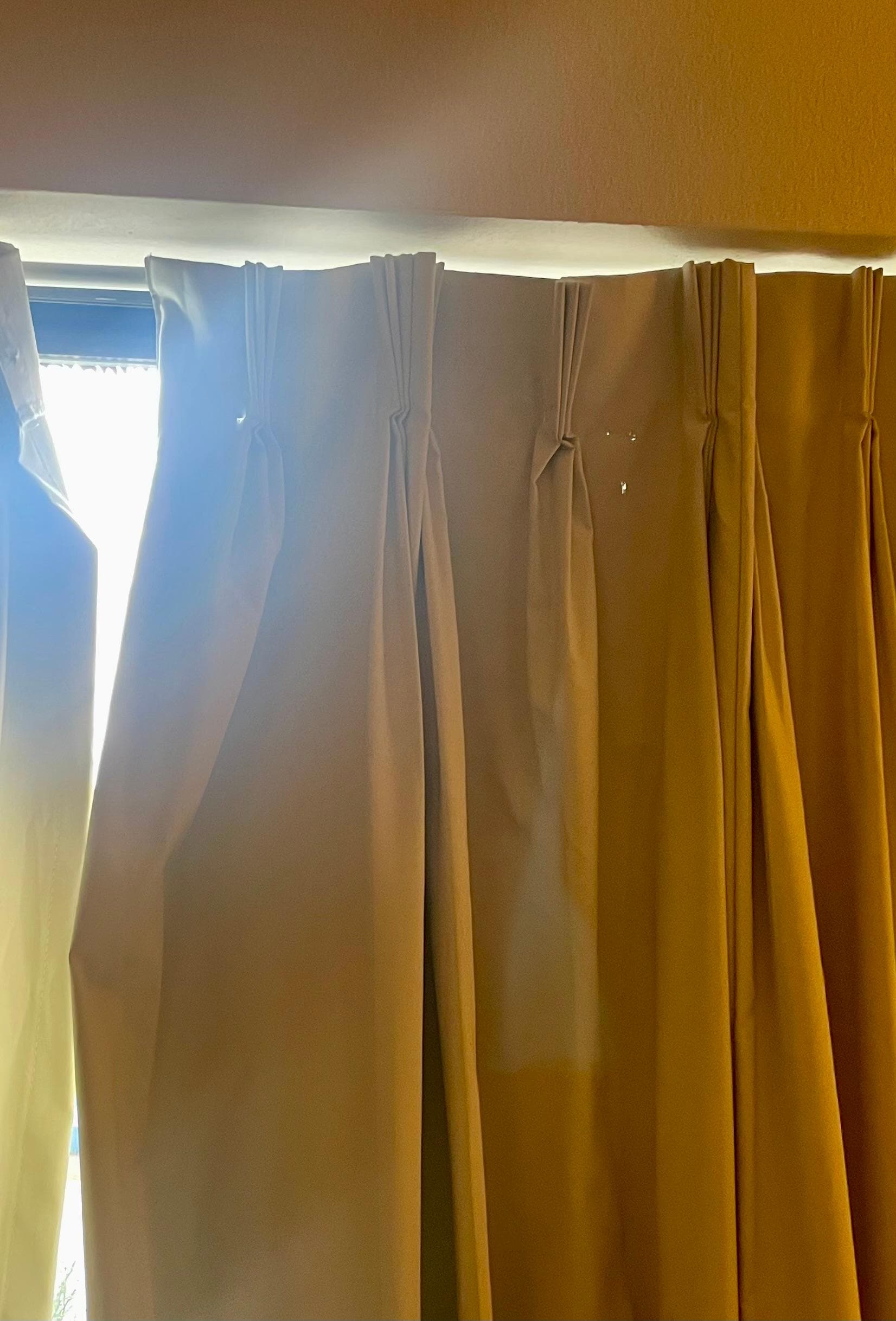 Curtains torn and hanging